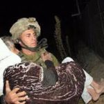 soldier carrying woman