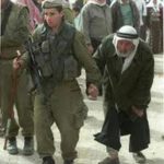 soldier leading arab